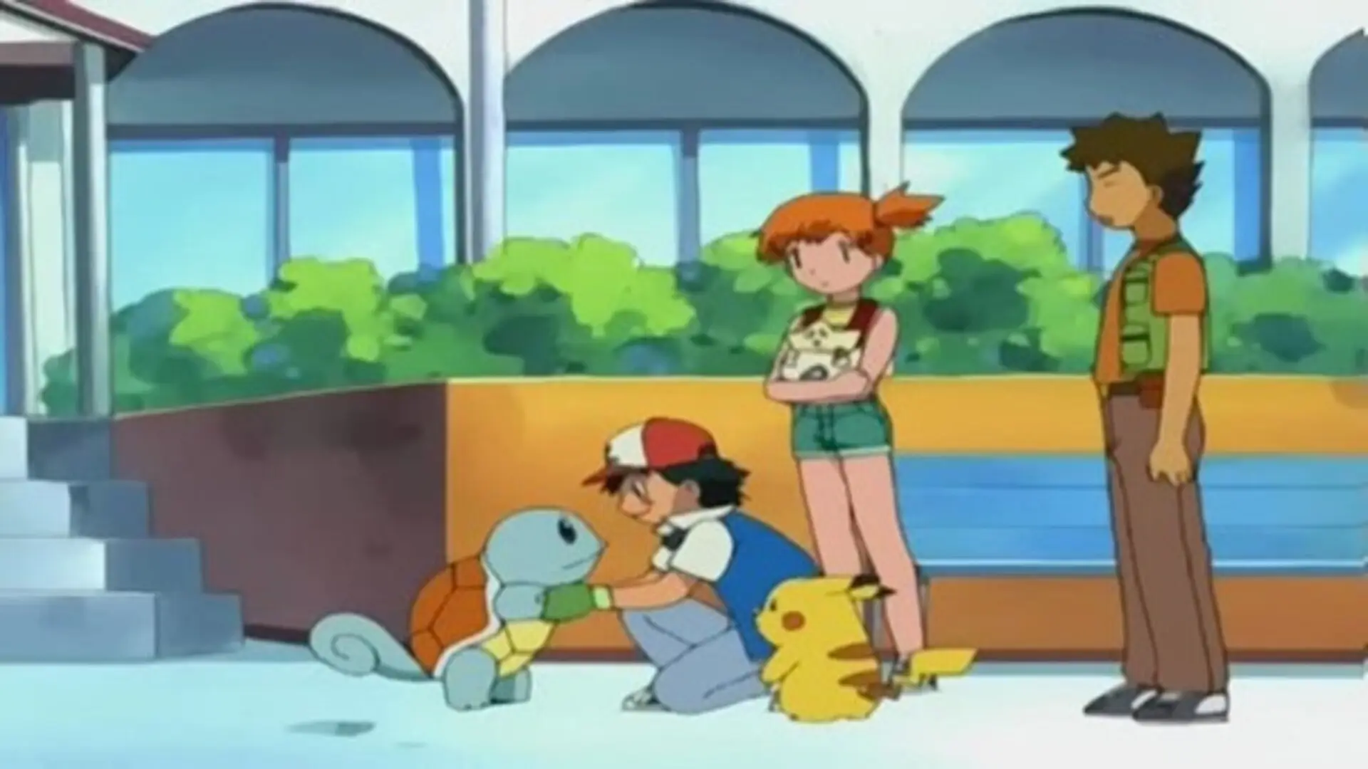 Escena nostálgica de Pokémon: La Búsqueda del Maestro (2001), con Ash, Misty y Brock en Johto